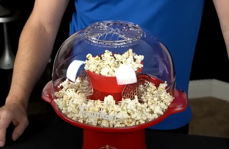 popping popcorn in a popcorn machine